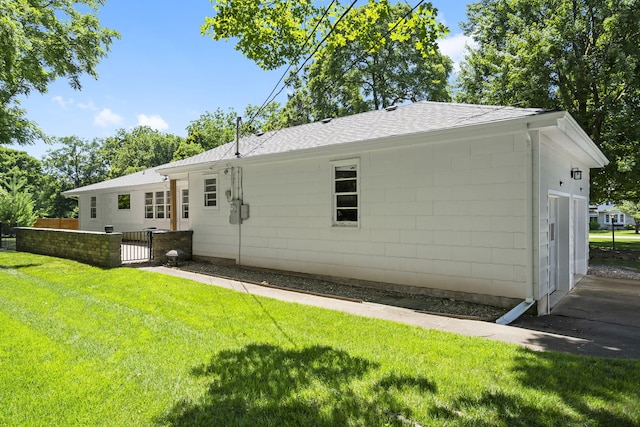 1471 E Bennett St, Springfield, MO 65804 - back of property featuring roof with shingles and concrete block siding