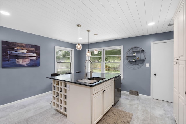 1471 E Bennett St, Springfield, MO 65804 - kitchen featuring dark countertops, healthy amount of natural light, recessed lighting, open shelves, and a kitchen island with sink
