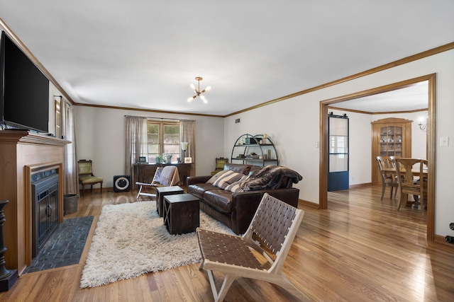 1471 E Bennett St, Springfield, MO 65804 - living area featuring a chandelier, ornamental molding, a fireplace with flush hearth, and wood finished floors