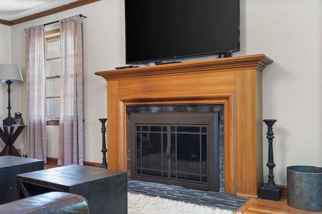 1471 E Bennett St, Springfield, MO 65804 - detailed view of a fireplace with flush hearth, wood finished floors, and ornamental molding