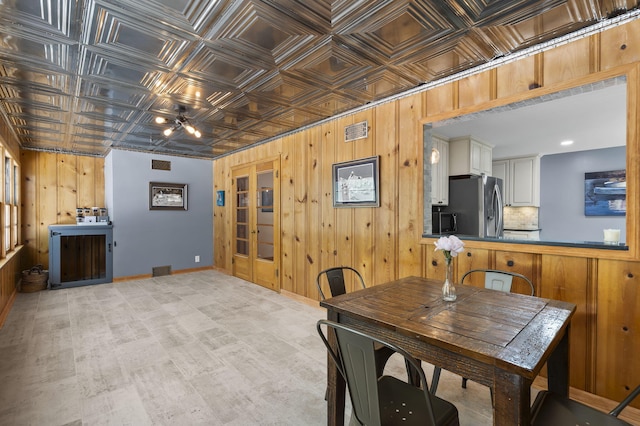 1471 E Bennett St, Springfield, MO 65804 - dining space featuring wood walls, an ornate ceiling, and a ceiling fan