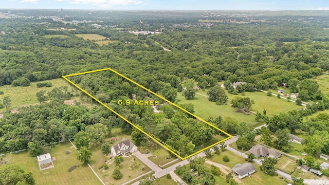 1850 E Farm Road 88, Springfield, MO 65803 - aerial view of property's location with property parcel outlined and a forest