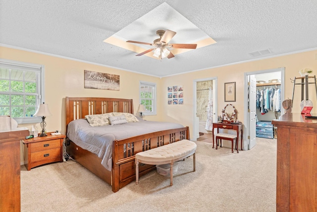 1850 E Farm Road 88, Springfield, MO 65803 - bedroom featuring a textured ceiling, light carpet, multiple windows, ornamental molding, and a spacious closet