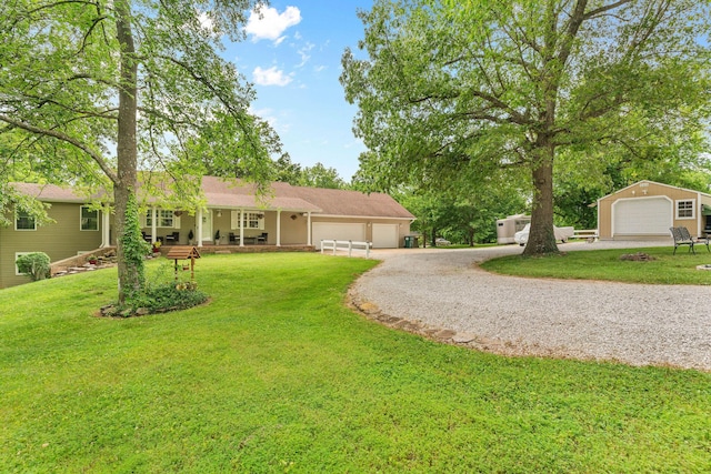 1850 E Farm Road 88, Springfield, MO 65803 - ranch-style house featuring gravel driveway, a front lawn, and an attached garage