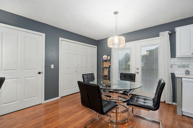 801 S Creekwood Ct, Nixa, MO 65714 - dining space featuring light wood-style floors and a chandelier
