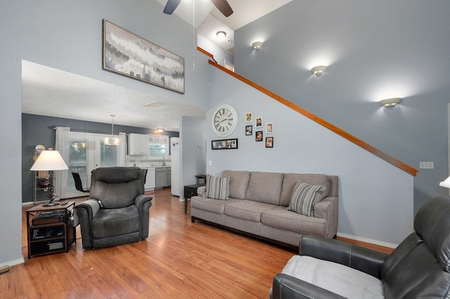 801 S Creekwood Ct, Nixa, MO 65714 - living room with ceiling fan, light wood-style floors, and a high ceiling