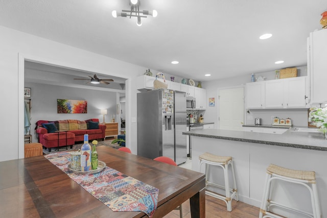 676 E Gallup Hill Rd, Nixa, MO 65714 - dining area featuring recessed lighting, ceiling fan, and light wood-type flooring