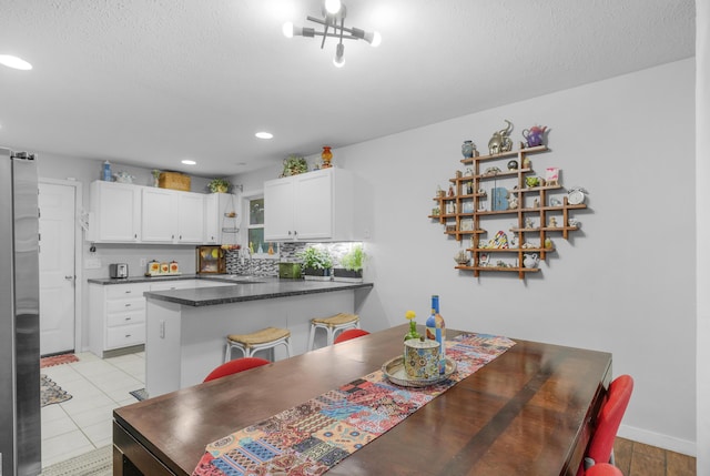 676 E Gallup Hill Rd, Nixa, MO 65714 - dining room with recessed lighting and a textured ceiling