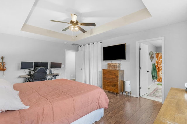 676 E Gallup Hill Rd, Nixa, MO 65714 - bedroom with a raised ceiling, hardwood / wood-style flooring, and a ceiling fan