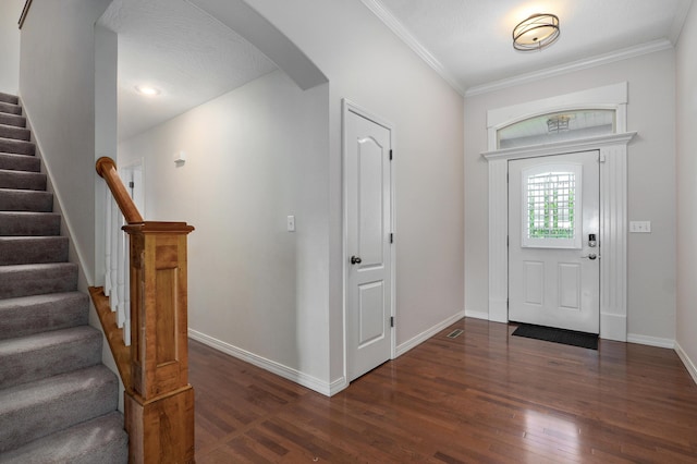 276 Steury Rd, Springfield, MO 65809 - foyer with wood finished floors, arched walkways, stairs, and ornamental molding