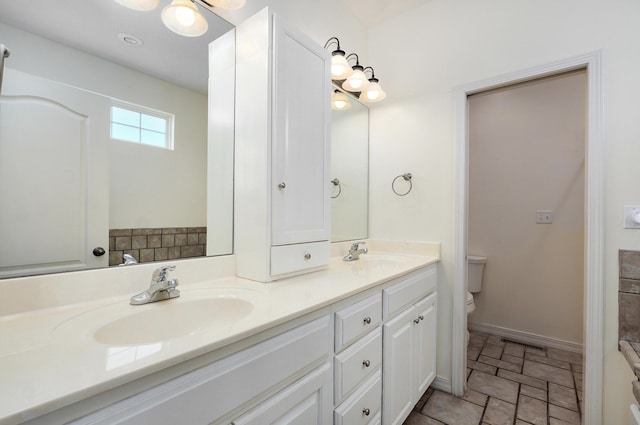 276 Steury Rd, Springfield, MO 65809 - full bathroom with double vanity and stone finish flooring