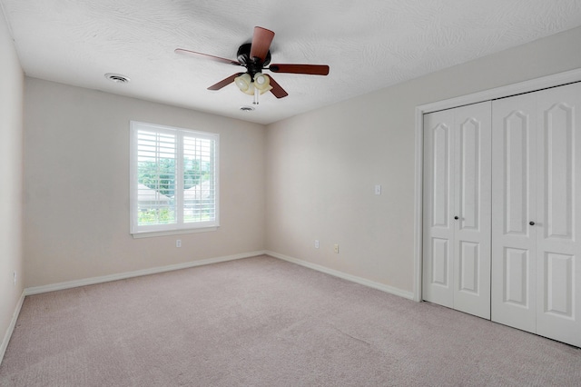276 Steury Rd, Springfield, MO 65809 - unfurnished bedroom featuring carpet, a closet, and a ceiling fan