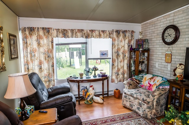 1950 N Crossway Rd, Fair Grove, MO 65648 - living area with wood finished floors and brick wall