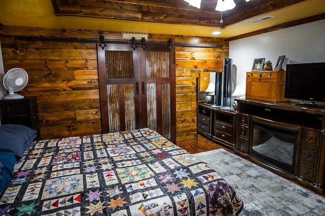 1950 N Crossway Rd, Fair Grove, MO 65648 - bedroom with a barn door and wood finished floors