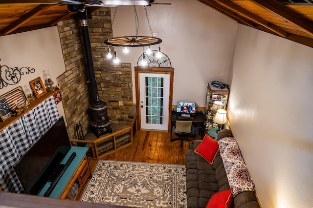 1950 N Crossway Rd, Fair Grove, MO 65648 - living area featuring ceiling fan, a wood stove, wood finished floors, wooden ceiling, and a desk