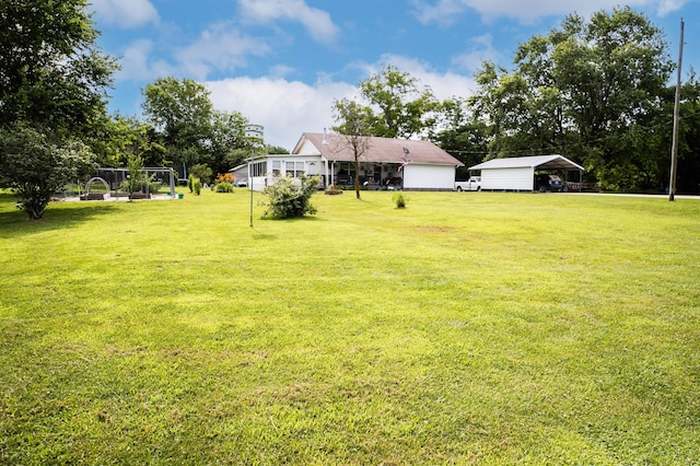 1950 N Crossway Rd, Fair Grove, MO 65648 - view of grassy yard with a detached carport