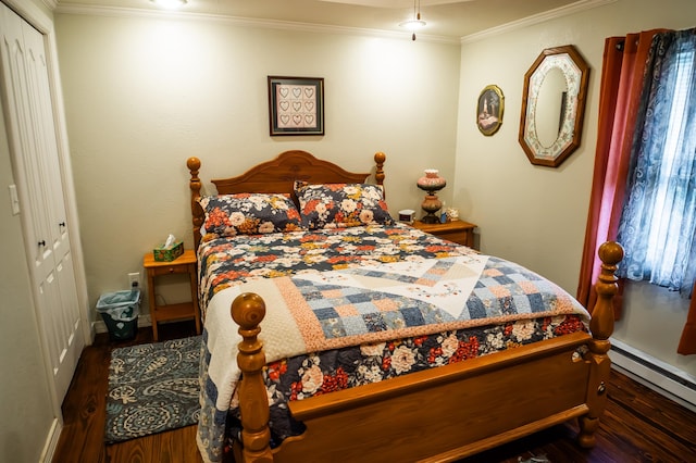1950 N Crossway Rd, Fair Grove, MO 65648 - bedroom with wood finished floors, ornamental molding, a closet, and a baseboard radiator