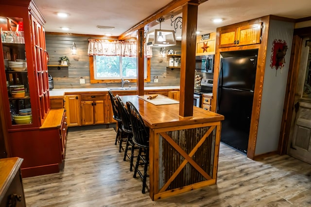 1950 N Crossway Rd, Fair Grove, MO 65648 - kitchen with appliances with stainless steel finishes, open shelves, and light wood finished floors