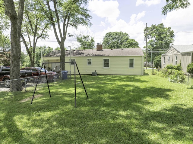 1650 S Fort Ave, Springfield, MO 65807 - rear view of property with a chimney and a playground