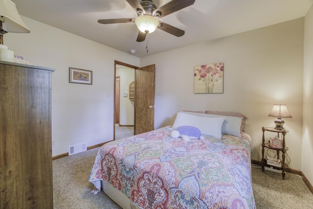 1650 S Fort Ave, Springfield, MO 65807 - carpeted bedroom with baseboards and a ceiling fan