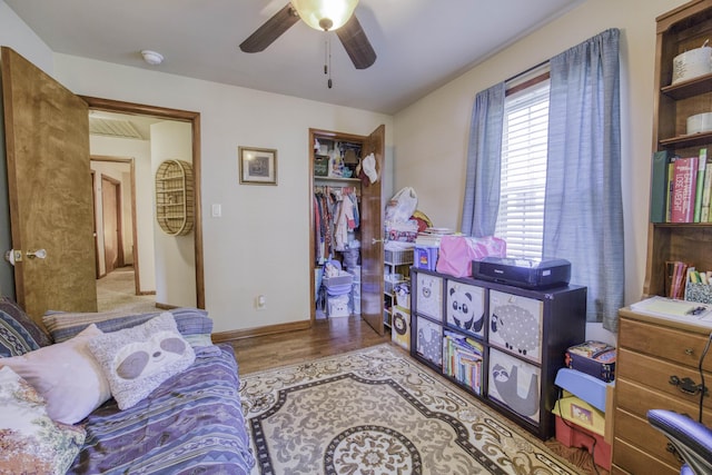 1650 S Fort Ave, Springfield, MO 65807 - bedroom featuring a closet, wood finished floors, and ceiling fan