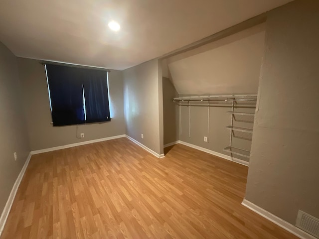 630 W State St, Springfield, MO 65806 - unfurnished bedroom with wood finished floors and lofted ceiling