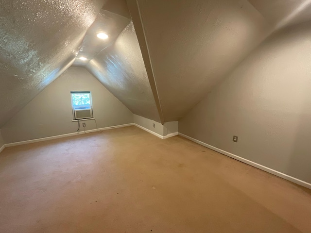 630 W State St, Springfield, MO 65806 - bonus room featuring vaulted ceiling, a textured ceiling, and light carpet
