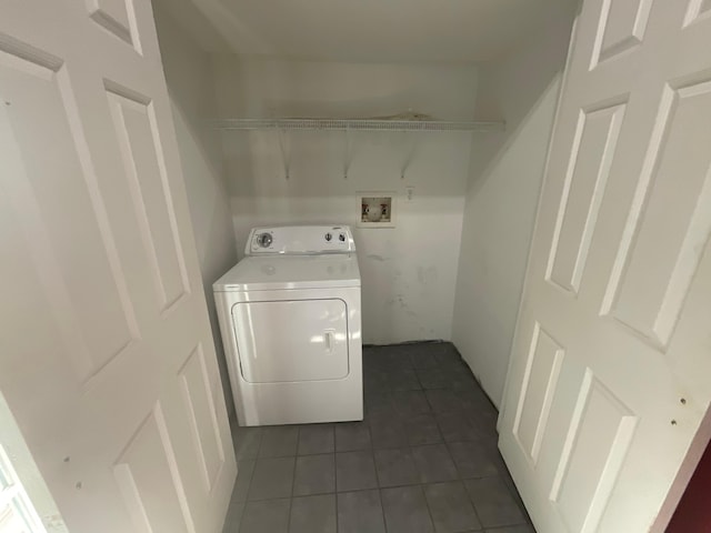 630 W State St, Springfield, MO 65806 - laundry room featuring washer / clothes dryer and dark tile patterned floors