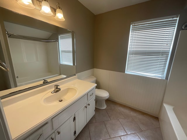 630 W State St, Springfield, MO 65806 - full bath featuring vanity, wainscoting, tile patterned floors, and shower / tub combination