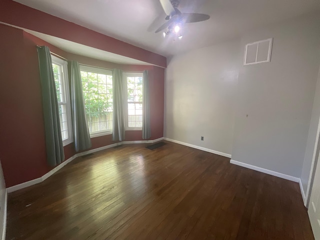 630 W State St, Springfield, MO 65806 - empty room featuring a ceiling fan and dark wood-type flooring