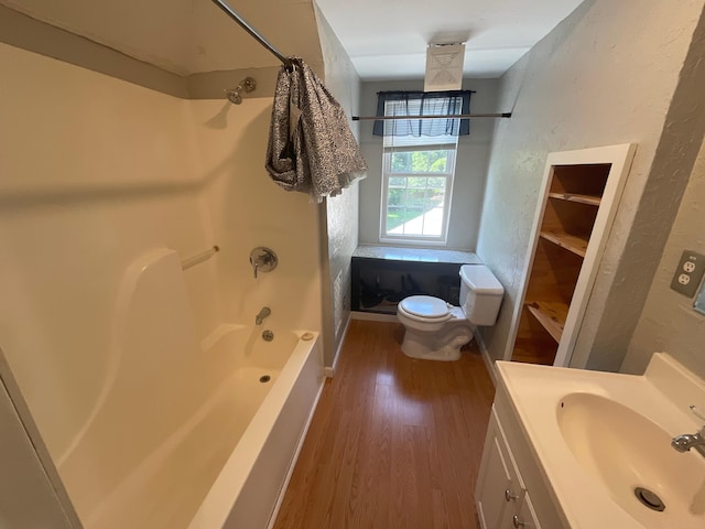 630 W State St, Springfield, MO 65806 - full bathroom featuring shower / bathtub combination, wood finished floors, vanity, and a textured wall