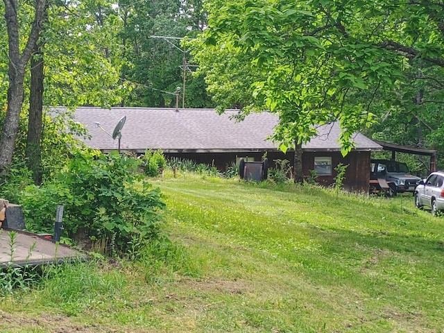 16680 Cantrell Dr, Licking, MO 65542 - view of front of home featuring a shingled roof and an attached carport