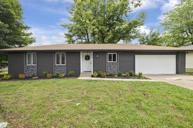 4959 S Mccann Ave, Springfield, MO 65804 - single story home with a garage, driveway, a front lawn, and brick siding