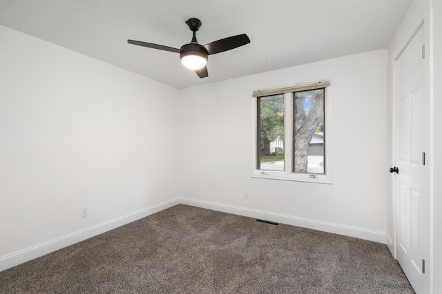 4959 S Mccann Ave, Springfield, MO 65804 - spare room with dark carpet and ceiling fan