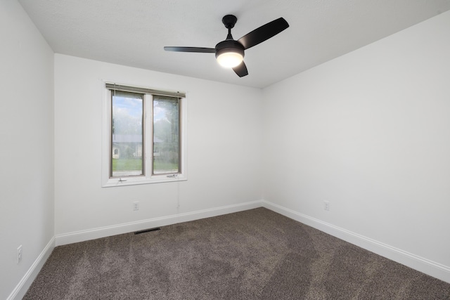 4959 S Mccann Ave, Springfield, MO 65804 - empty room featuring dark carpet and ceiling fan