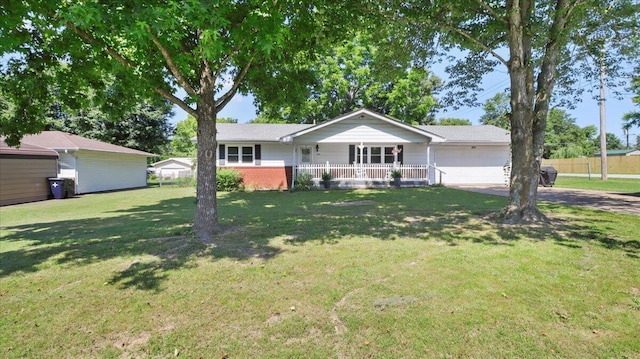 1931 Kay Dr, West Plains, MO 65775 - ranch-style home with a garage, a porch, and concrete driveway