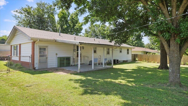 1931 Kay Dr, West Plains, MO 65775 - rear view of property featuring a patio and a fenced backyard