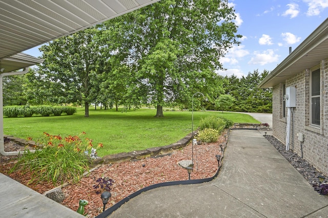 615 W Mchenry Ave, Billings, MO 65610 - view of grassy yard featuring a patio area