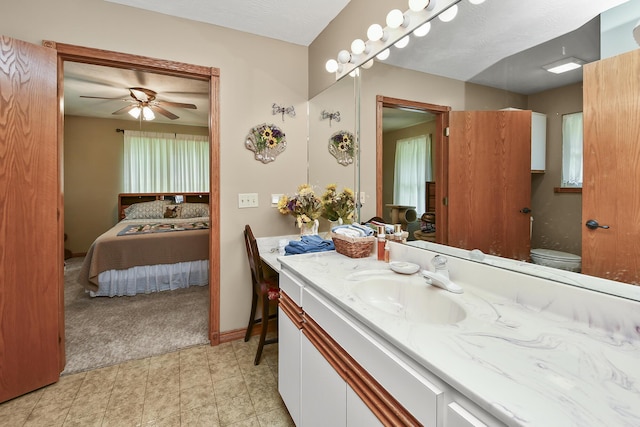 615 W Mchenry Ave, Billings, MO 65610 - ensuite bathroom with vanity, ceiling fan, and tile patterned floors