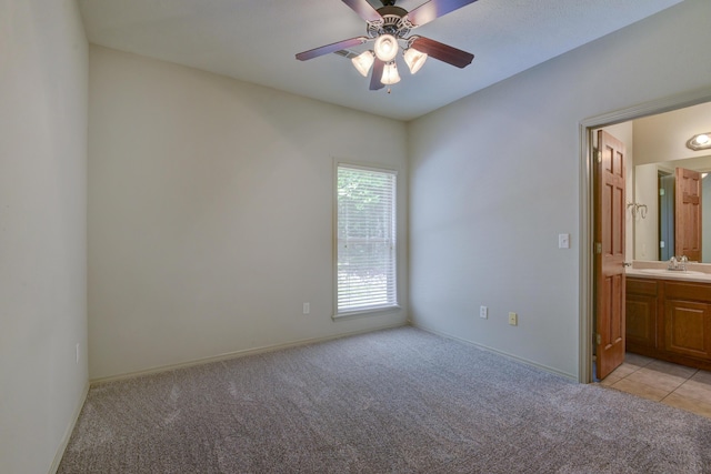 613 Crossing Dr, Branson West, MO 65737 - unfurnished bedroom featuring light colored carpet, ensuite bathroom, and ceiling fan