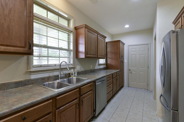 613 Crossing Dr, Branson West, MO 65737 - kitchen featuring appliances with stainless steel finishes, dark countertops, and light tile patterned flooring
