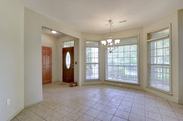 613 Crossing Dr, Branson West, MO 65737 - entrance foyer with a chandelier, healthy amount of natural light, and light tile patterned flooring