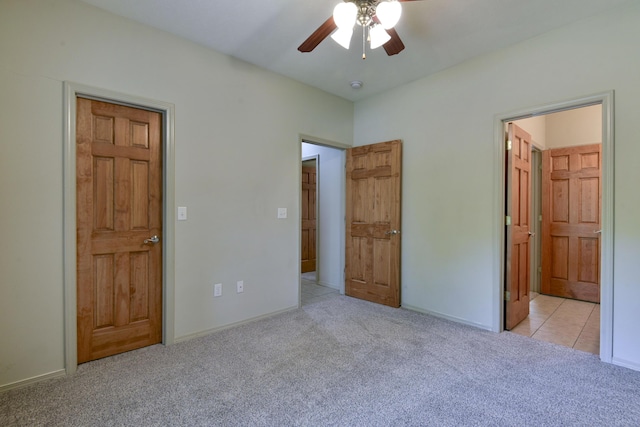 613 Crossing Dr, Branson West, MO 65737 - unfurnished bedroom with carpet floors, connected bathroom, and ceiling fan