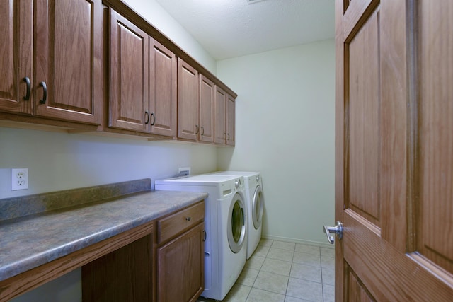 613 Crossing Dr, Branson West, MO 65737 - washroom featuring cabinet space, washing machine and clothes dryer, and light tile patterned flooring