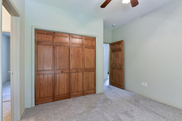 613 Crossing Dr, Branson West, MO 65737 - unfurnished bedroom with light colored carpet, a closet, and ceiling fan