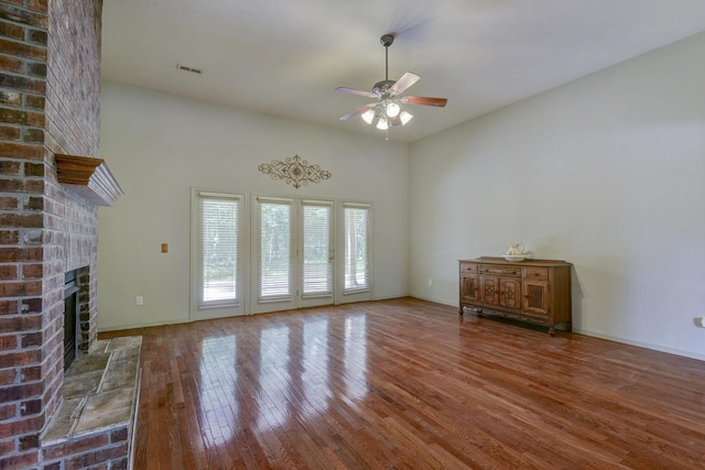 613 Crossing Dr, Branson West, MO 65737 - unfurnished living room with a ceiling fan, hardwood / wood-style floors, and a fireplace