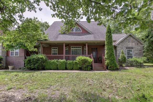 613 Crossing Dr, Branson West, MO 65737 - view of front facade featuring a porch, a front yard, and a shingled roof