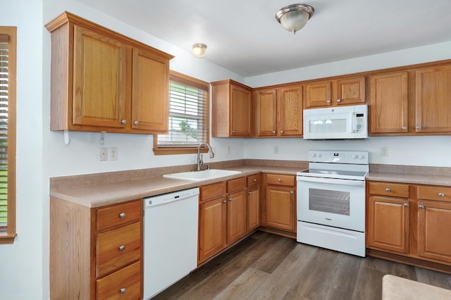 409 Ace Ct, Nixa, MO 65714 - kitchen with white appliances, dark wood-style floors, light countertops, and brown cabinetry