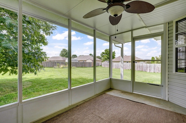 409 Ace Ct, Nixa, MO 65714 - unfurnished sunroom with ceiling fan and a residential view