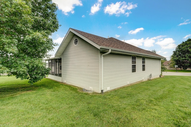 409 Ace Ct, Nixa, MO 65714 - view of home's exterior featuring a yard, roof with shingles, and a sunroom